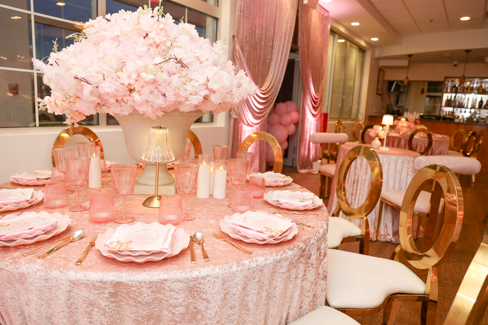 Pink and gold tablescape with floral centerpiece