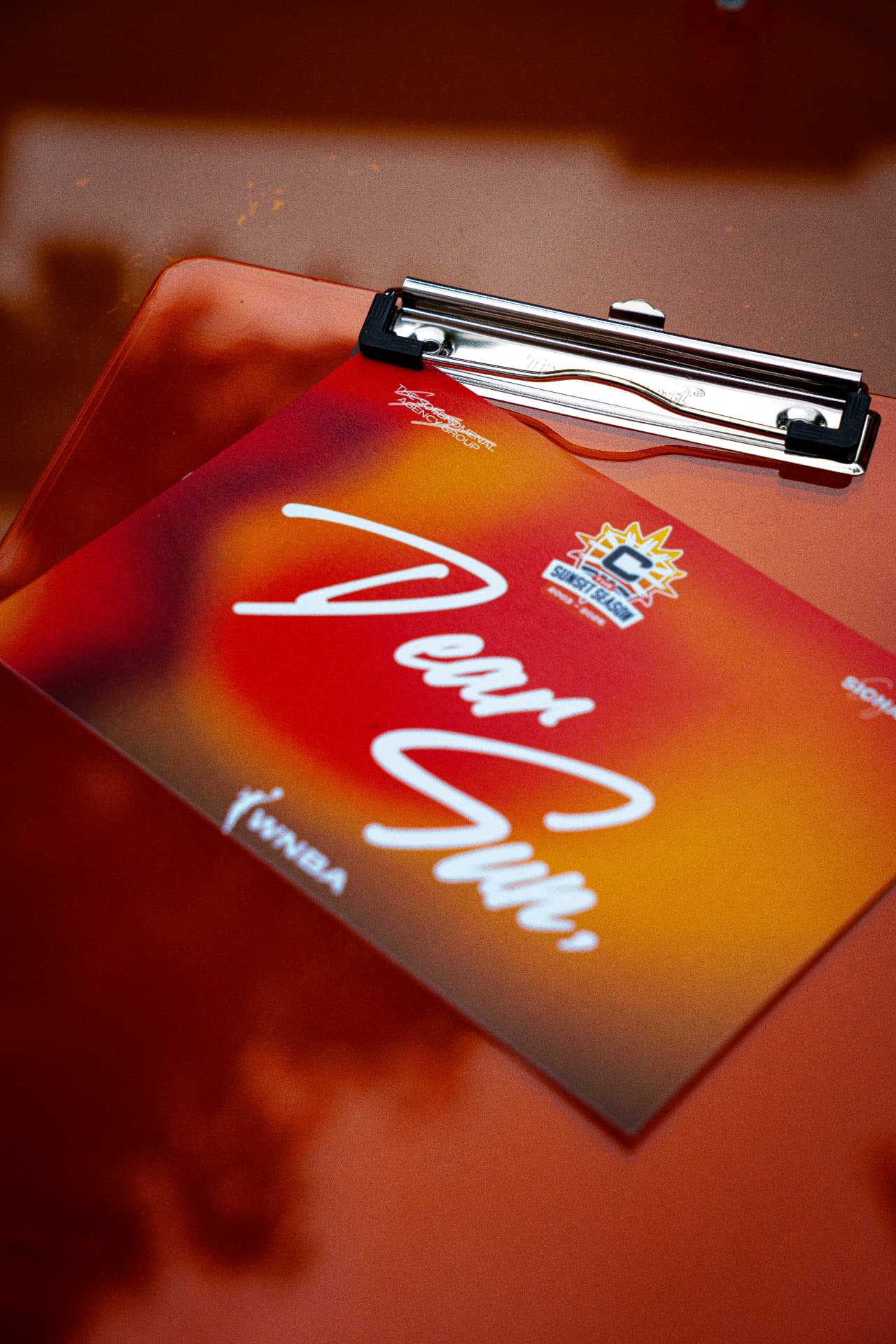 Branded clipboard detail at a corporate event